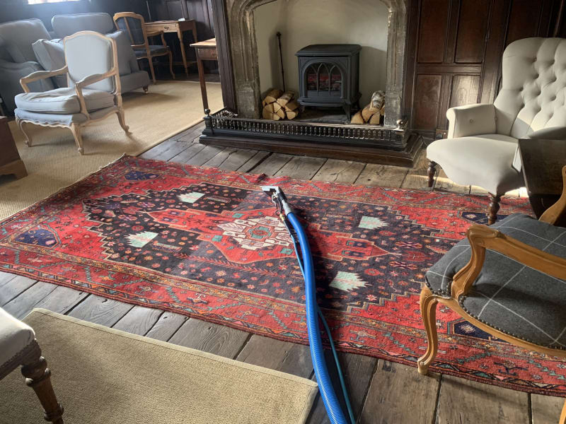 Antique rug cleaning showing before & after